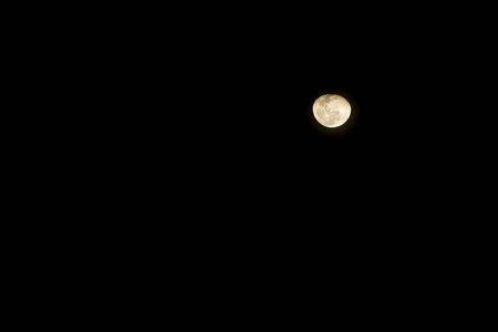 the warning moon  in a third quarter on dark skyの写真素材