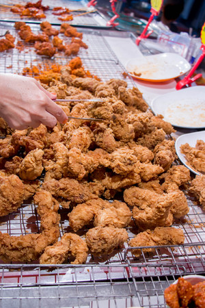 customer pick up fried chicken : popular food in South Thailand street market