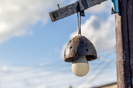 Thai ancient wooden light pole made from coconut shellの写真素材