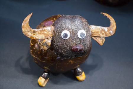 cute buffalo handmade from coconut shell sell in Thailandの写真素材