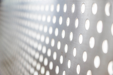 silver steel metallic hole texture backgroundの写真素材