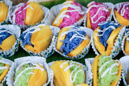 Jackfruit with sticky rice and coconut milk cream, Thai food use nature blue color with butterfly pea flower and green color with pandanの写真素材