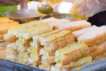 garlic bread grilled with butter sell in street marketの写真素材
