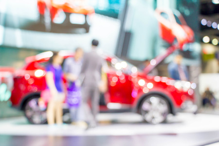 blurred people in motor show exhibitionの写真素材
