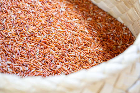 brown rice in natural basket at Thailand marketの写真素材