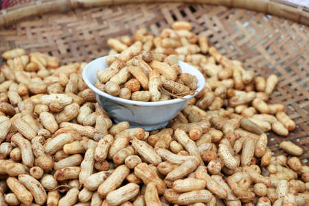 boiled peanut in wood tray sold  in Thailand street food