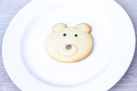 bear homemade cookie on white plateの写真素材