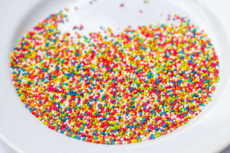 colorful sprinkles on white plate
