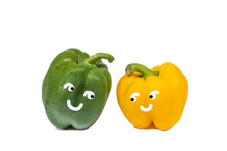 cute fresh green and yellow bell peppers isolated on white backgroundの写真素材