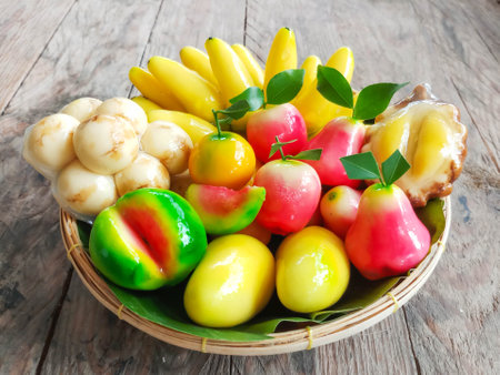 kanom Look Choup : Thai traditional dessert deletable imitation fruits made from green been, coconut milk, sugar and jelly in fruit shape (look like Marzipan)の写真素材