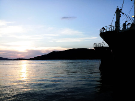 silhouette of big boat at the sea on sunset skyの写真素材