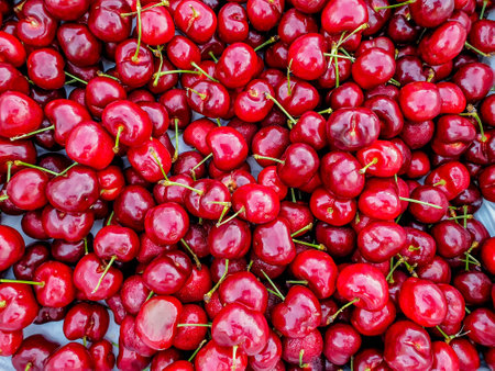 a pile of fresh red cherry using for backgroundの写真素材