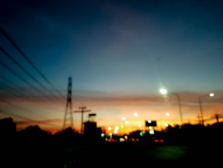 abstract blur bokeh of night light city road at sunsetの写真素材