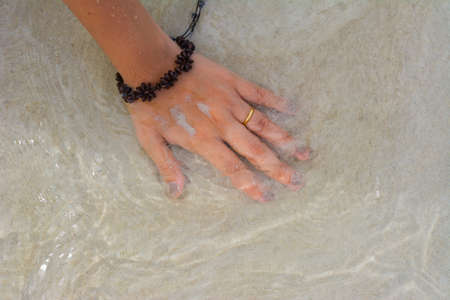 hand on the sandの写真素材