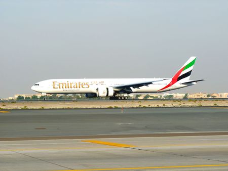 DUBAI, UAE - NOVEMBER 18: Emirates Boeing 777 aircraft landing during Dubai Air Show at Airport Expo Dubai のeditorial素材