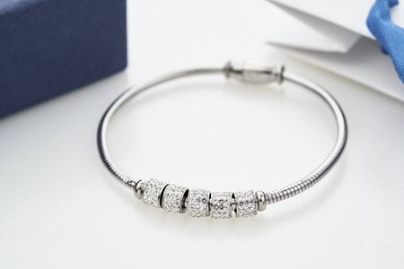 Close up shot of beautiful silver bracelet with crystals isolated on white