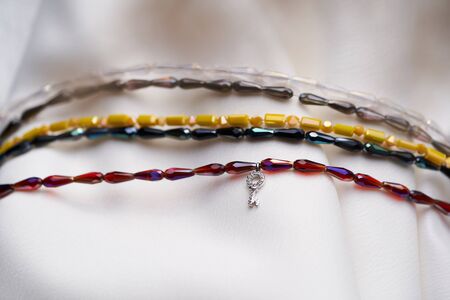 Beautiful and stylish bracelets with beads and crystals of different colors isolated on white background. Women accessories.の写真素材