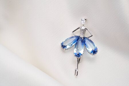 Silver brooch shaped like a ballerina, dancer with small diamonds, isolated on white background. Women Accessoriesの写真素材