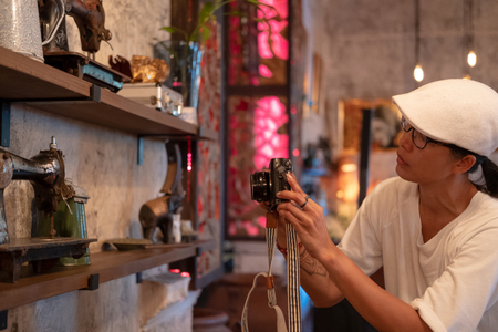 Happy Asian Tourist taking photo