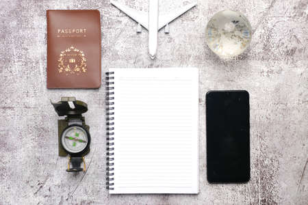 Flatlay of travel planning concept on stone table . Many country tend to open their border in order to boost their tourism industry after covid-19 outbreak.の写真素材