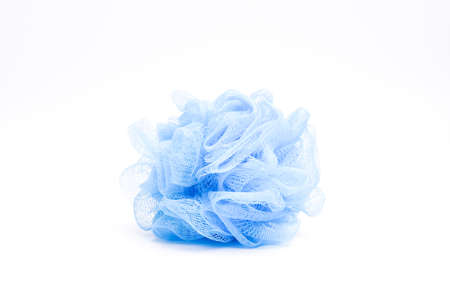 Blue loofa or net body scrubber on isolated white backgroundの写真素材