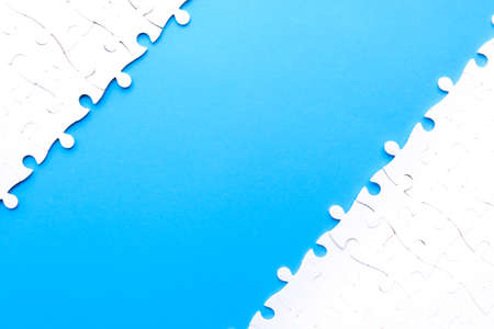 Separated puzzles on blue background.  For consulting and looking for solution concept.の写真素材