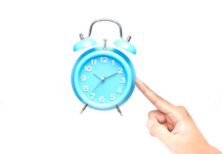 A levitation concept picture of table clock above hand. Time management and success planning conceptの写真素材