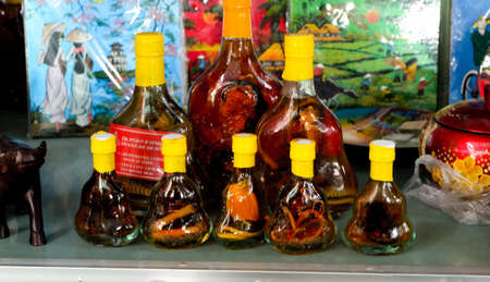 A picture of snake wine sold on the tableのeditorial素材