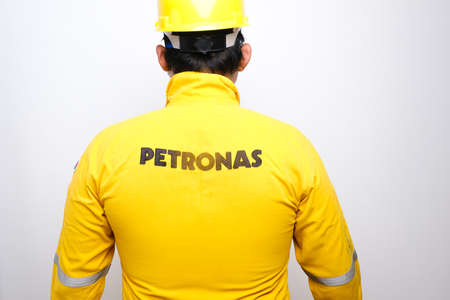  Klang,Malaysia- Circa August, 2020: A men working as petroleum engineer wearing Petronas coverall...