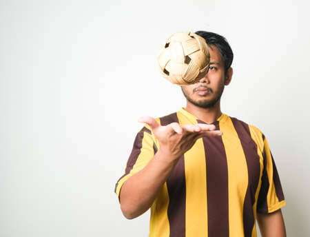 Selective focus picture of "takraw" ball been tossed by a men. "Takraw" is a sport famous in South East Asia.の写真素材