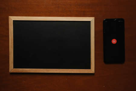 "Klang,Malaysia- Circa October, 2020: A dark theme picture of Youtube Music apps on Samsung smartphone blackboard. New Youtube and Google apps for competing Spotify."のeditorial素材