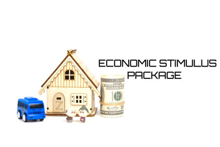 Economic stimulus package concept with miniatures, fake coin and word.