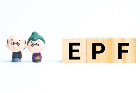 Old miniature on slwith EPF wooden block. EPF stands for employee provided fund.の写真素材
