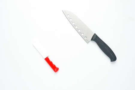 toy knife and real knife on white backgroundの写真素材