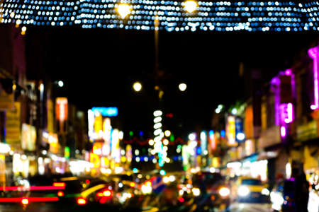 Intentional lens blur and light bokeh with noise effect image at busy street in Little India Klang.
