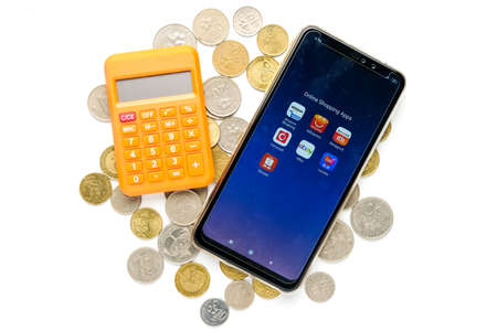 "Klang,Malaysia- Circa November, 2020: A flatlay picture of smartphone with variety Online Shopping Apps and calculator on coins. Trend online shopping has increase during covid-19 pandemic.のeditorial素材
