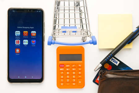 "Klang,Malaysia- Circa November, 2020: Flatlay picture of online or e-shopping platform in smartphone with other prop insight. Online shopping among user during covid-19 record Trillions of dollar."のeditorial素材
