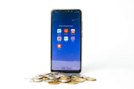 "Klang,Malaysia- Circa November, 2020: A picture of online shopping apps at smartphone with cart and coins. Millions of dollar in daily online shopping transaction."のeditorial素材