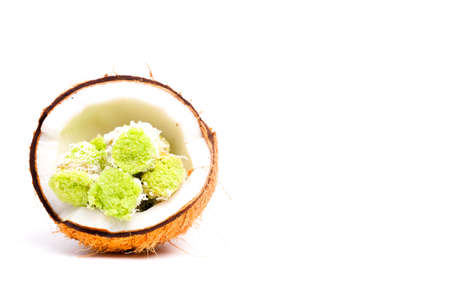 "Kue putu" or "putu bambu" is a traditional Nusantara Southeast Asian cylindrical shaped and green colored steamed cake. In the coconut.の写真素材