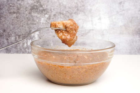 A picture of "nasi impit" or pressed rice dip into "kuah kacang"or peanut sauce. Popular serve during Eid or snack time.の写真素材