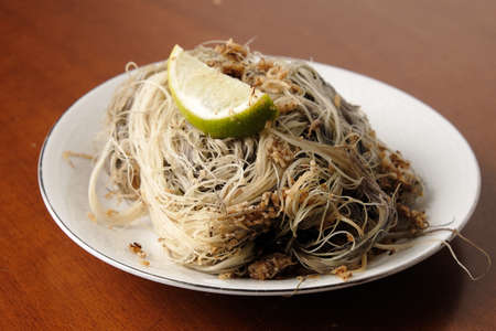 A plate of kerabu sare' or seawood salad. Exotic food from Kelantan Malaysia made with seaweed,...