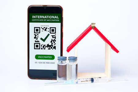 A picture of smartphone with fake International Certificate of Vaccination on it. Also Covid-19...