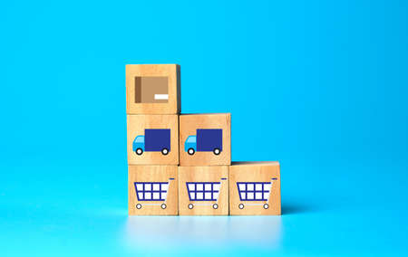 Wooden blocks with online shopping symbols on wooden backgroundの写真素材