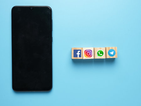 Facebook, Instagram, Whatsapp and Telegram logo on wooden block for Social Media contact conceptのeditorial素材