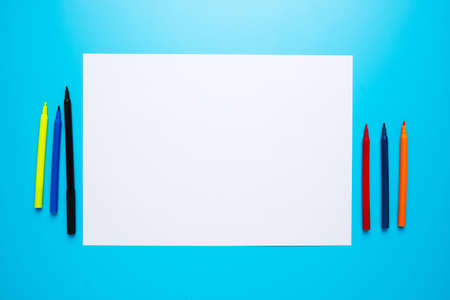Copyspace white paper with magic pen on blue background. Idea and creativity concept