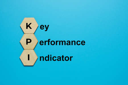 A picture of KPI on hexagon wood and the word Key Performane Indicator word. Measurement for achievement rate.の写真素材