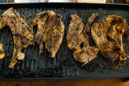 Selective focus picture of ready to eat mutton on the grille. Mutton is famous in Malaysia during...