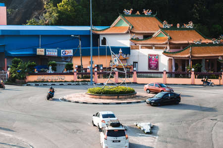 Mersing, Malaysia- Circa December, 2021: Selective focus picture of Mersing roundabout full of cars...