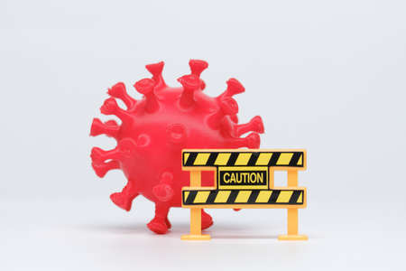 A picture of Covid-19 3D printed module with caution sign. Caution with new variant of coronavirus