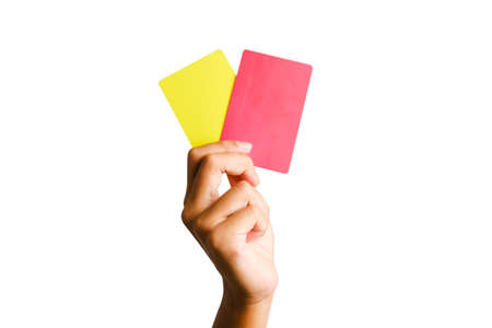 Selective focus of hand holding yellow and red card. Sports offence and law violation concept.の写真素材